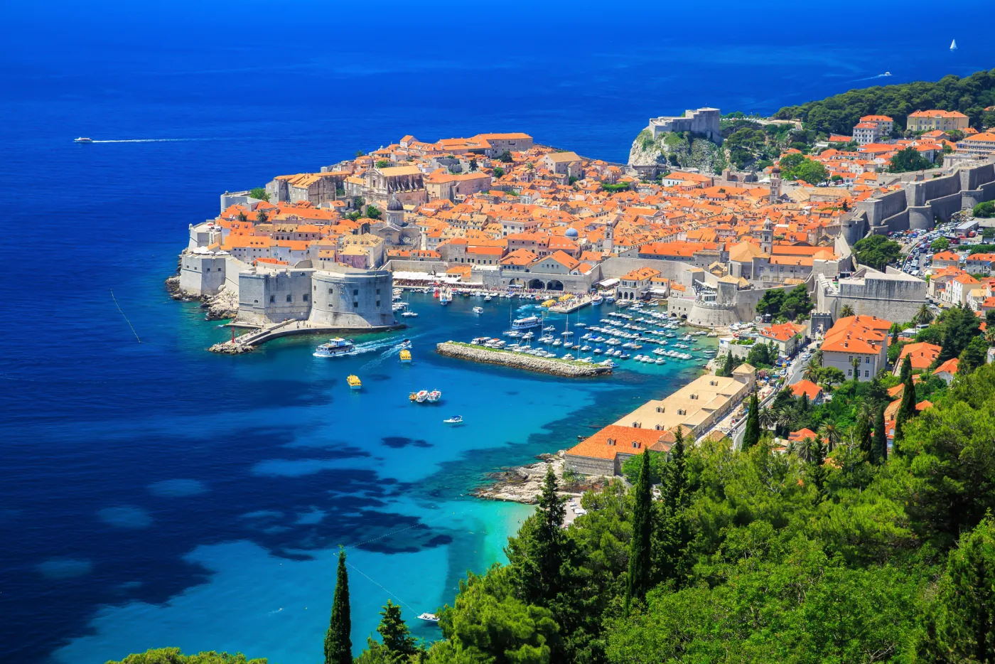 Dubrovnik Old Town Croatia - ancient city walls and terracotta roofs overlooking Adriatic Sea, luxury private tours destination