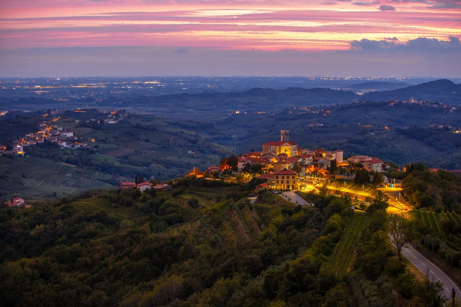 Hilltop village and vineyards in Goriška Brda at sunset
