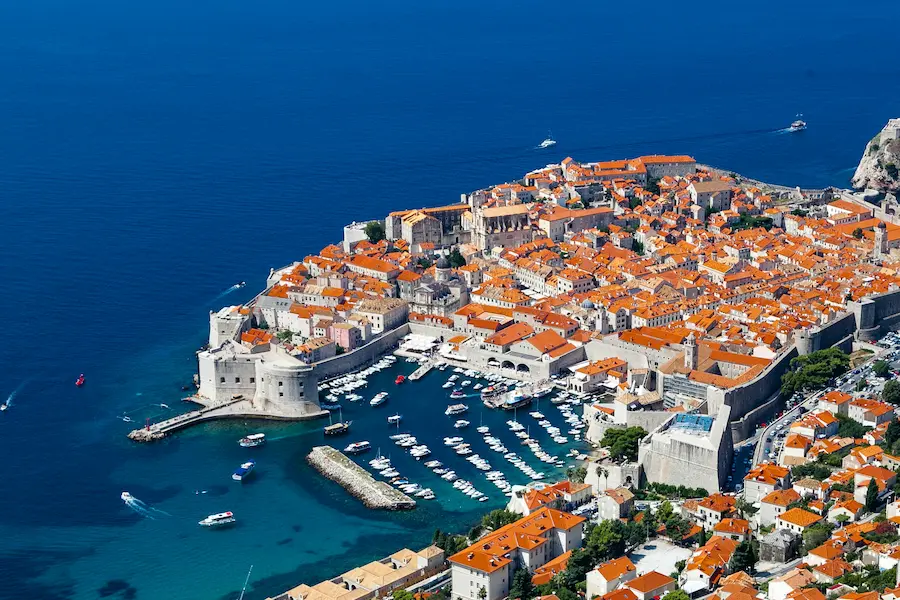 Dubrovnik Old Town Croatia - ancient city walls and terracotta roofs overlooking Adriatic Sea, luxury private tours destination