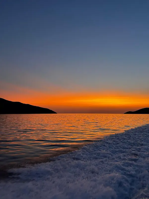 Romantic sunset cruise on Croatian Adriatic - golden hour sailing with champagne and panoramic coastal views