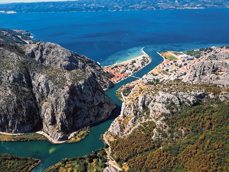 Zip-lining over Cetina River canyon Croatia - adrenaline adventure tour with dramatic river scenery and mountain views