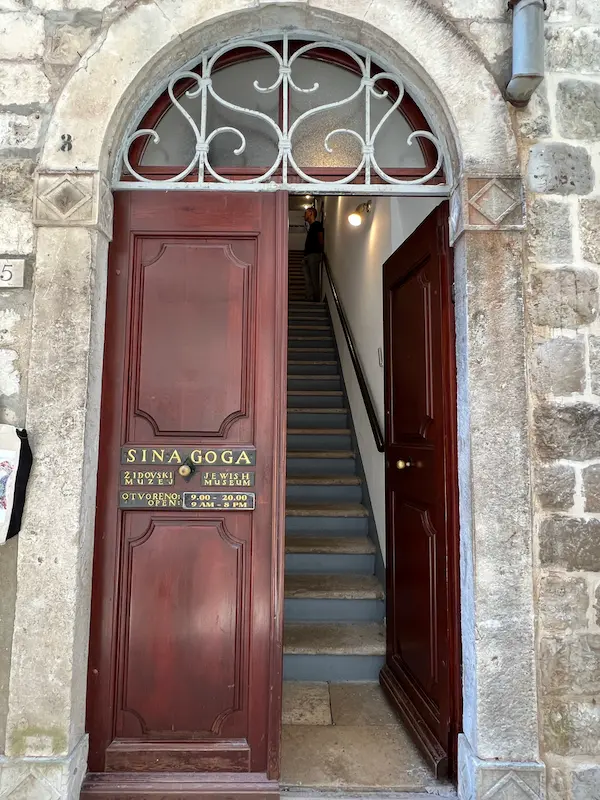 Dubrovnik synagogue entrance Croatia - Jewish Museum historic wooden door with ornate arch