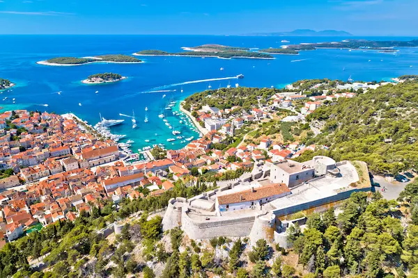 Hvar Island aerial view Croatia - Fortress overlooking old town and Pakleni Islands in turquoise Adriatic Sea